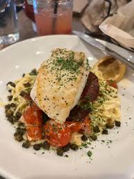 Contrada signature dishes Whipped RicottaAgnolottiPork Milanese
